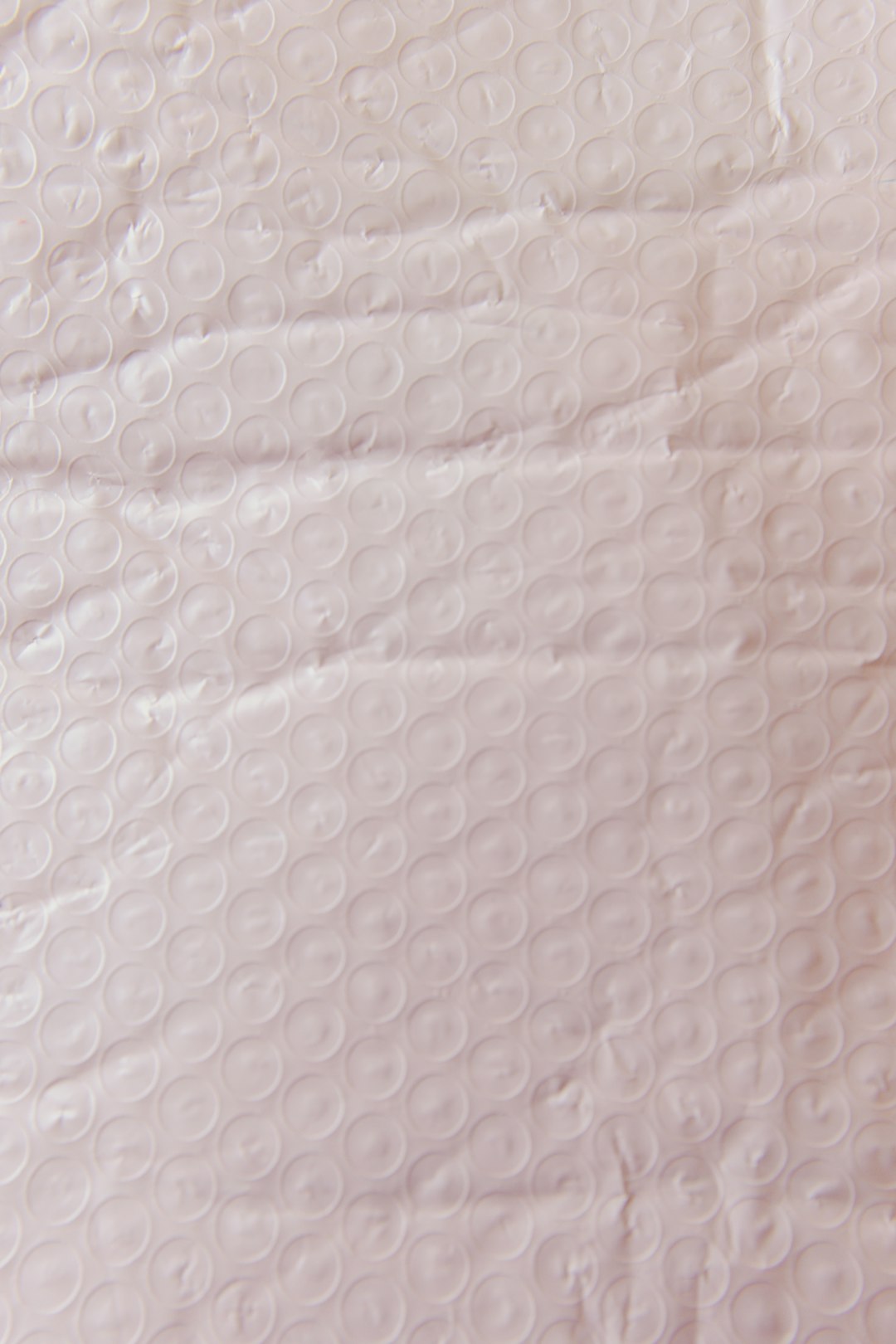 Pink translucent plastic packaging texture